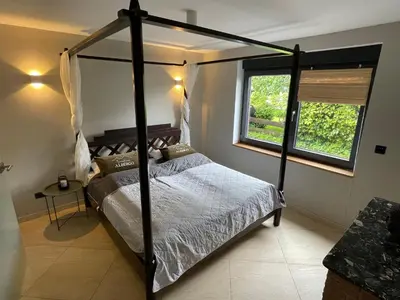 Ein Bett oder Betten in einem Zimmer der Unterkunft Wellness Suite für 2 Personen mit Sauna und Billardtisch