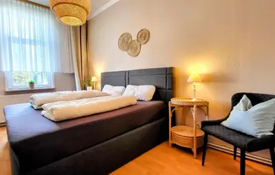 Ein Bett oder Betten in einem Zimmer der Unterkunft HIRSCH Apartment Fuchsbau - zentral - Garten