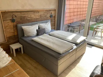Ein Bett oder Betten in einem Zimmer der Unterkunft Ferienwohnungen Garzke