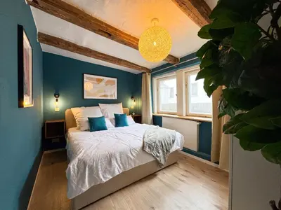Ein Bett oder Betten in einem Zimmer der Unterkunft Haus Ludwig - Saniertes Fachwerkhaus im Harz - 12 Personen