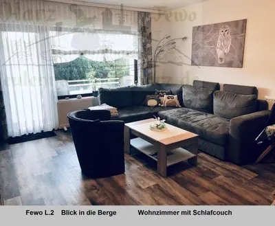 Ein Sitzbereich in der Unterkunft Harz Fewo Eulennestchen L2