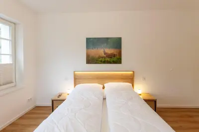 Ein Bett oder Betten in einem Zimmer der Unterkunft Ferienwohnung Hirschmann 2 mit Sauna und Balkon