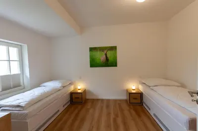 Ein Bett oder Betten in einem Zimmer der Unterkunft Ferienwohnung Hirschmann 4