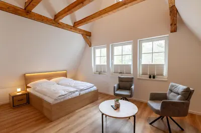 Ein Bett oder Betten in einem Zimmer der Unterkunft Ferienwohnung Hirschmann 7 mit Sauna, Kamin, Balkon