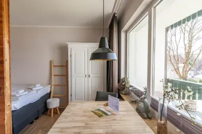 Ein Bett oder Betten in einem Zimmer der Unterkunft Ferienwohnung BergChalet 1 mit Balkon