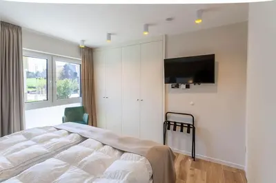 Ein Bett oder Betten in einem Zimmer der Unterkunft Ferienwohnung Carla mit Sauna und Balkon