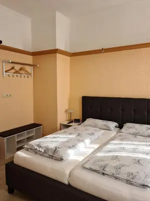 Ein Bett oder Betten in einem Zimmer der Unterkunft Pension Kreihe im Harz
