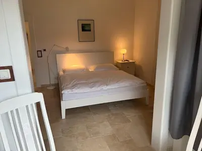 Ein Bett oder Betten in einem Zimmer der Unterkunft Villa Gesine FeWo plus