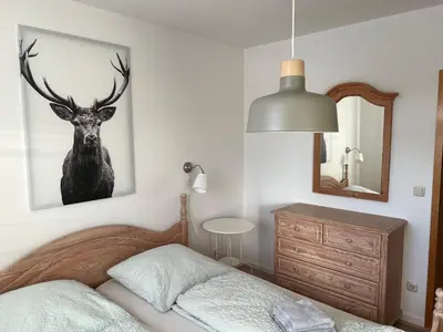 Ein Bett oder Betten in einem Zimmer der Unterkunft Urlaubshaus-Braunlage Wohnung 1