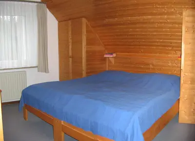 Ein Bett oder Betten in einem Zimmer der Unterkunft Appartements Am Hexenstieg