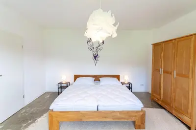 Ein Bett oder Betten in einem Zimmer der Unterkunft Ferienwohnung Familien Loft im Haus Tannenblick Lofts