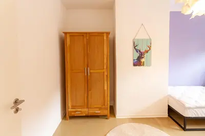 Ein Bett oder Betten in einem Zimmer der Unterkunft Ferienwohnung Familien Loft im Haus Tannenblick Lofts