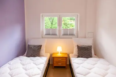Ein Bett oder Betten in einem Zimmer der Unterkunft Ferienwohnung Familien Loft im Haus Tannenblick Lofts