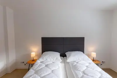 Ein Bett oder Betten in einem Zimmer der Unterkunft Ferienwohnung Garten Loft im Haus Tannenblick Lofts