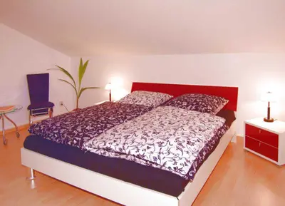 Ein Bett oder Betten in einem Zimmer der Unterkunft Ferienwohnung Zum Waldseebad