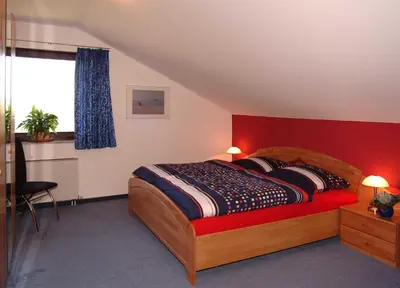 Ein Bett oder Betten in einem Zimmer der Unterkunft Ferienwohnung Zum Waldseebad