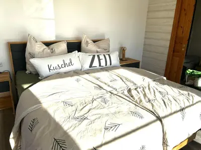 Ein Bett oder Betten in einem Zimmer der Unterkunft Ferienhaus HarzHase