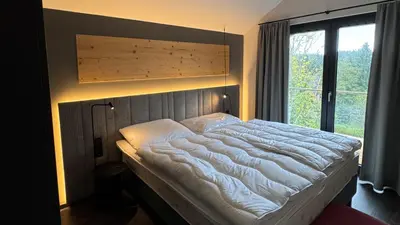 Ein Bett oder Betten in einem Zimmer der Unterkunft Hahnenklee Ferienchalets