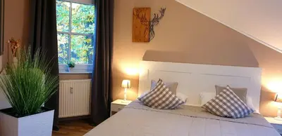Ein Bett oder Betten in einem Zimmer der Unterkunft Ferienwohnung 