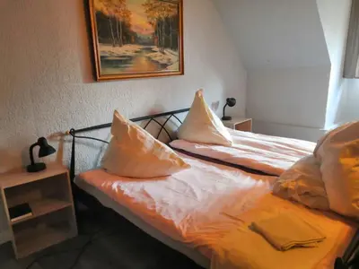 Ein Bett oder Betten in einem Zimmer der Unterkunft Hotel und Gaststätte Bierstübchen