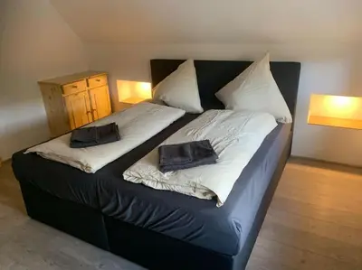 Ein Bett oder Betten in einem Zimmer der Unterkunft Jermerstein-Häuschen