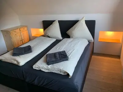 Ein Bett oder Betten in einem Zimmer der Unterkunft Jermerstein-Häuschen