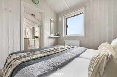 Ein Bett oder Betten in einem Zimmer der Unterkunft Ferienhaus Talblick Lodge - Neles Nest - Sankt Andreasberg im Harz