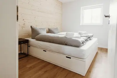 Ein Bett oder Betten in einem Zimmer der Unterkunft Harzchalet Brockenbahn 2A
