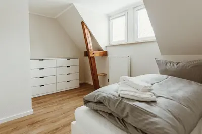 Ein Bett oder Betten in einem Zimmer der Unterkunft Harzchalet Brockenbahn 2B