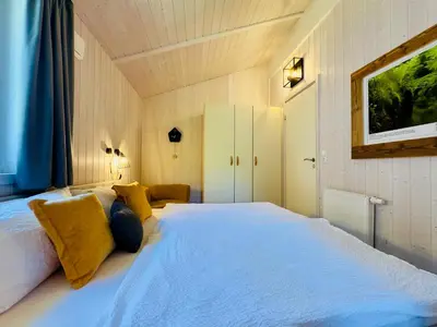 Ein Bett oder Betten in einem Zimmer der Unterkunft Ferienhaus Trollblume - Sankt Andreasberg im Harz