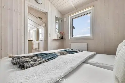 Ein Bett oder Betten in einem Zimmer der Unterkunft Ferienhaus Panorama-Traum 47 - Sankt Andreasberg im Harz