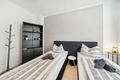 Ein Bett oder Betten in einem Zimmer der Unterkunft Schöne FeWo im EG mit Hof, für 4 Personen