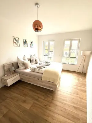 Ein Bett oder Betten in einem Zimmer der Unterkunft DesignSuite