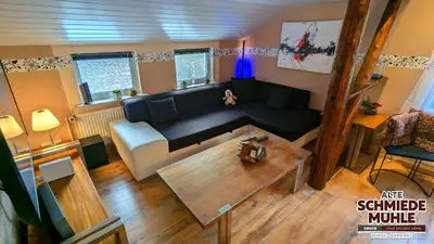 Ein Sitzbereich in der Unterkunft Arode Alte Schmiedemühle