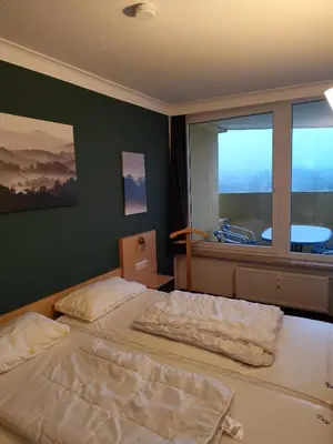 Ein Bett oder Betten in einem Zimmer der Unterkunft Apartment Morgengruß - Pool & Sauna