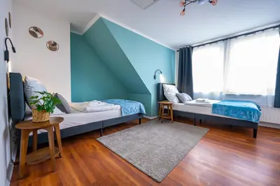 Ein Bett oder Betten in einem Zimmer der Unterkunft Ferienwohnung Stadtblick - Modernes Wohnen auf 2 Etagen