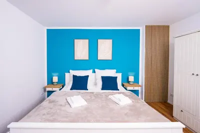 Ein Bett oder Betten in einem Zimmer der Unterkunft Ferienwohnung Stadtblick - Modernes Wohnen auf 2 Etagen