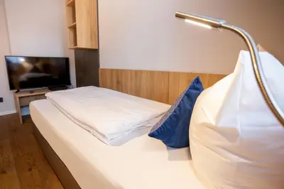 Ein Bett oder Betten in einem Zimmer der Unterkunft Chalet Bergzeit 7