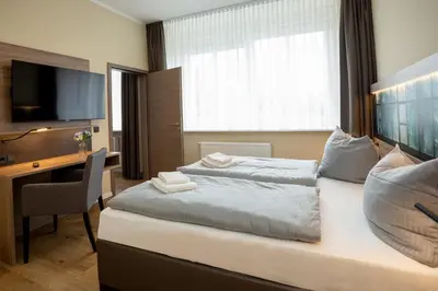 Ein Bett oder Betten in einem Zimmer der Unterkunft Lieblingsquartier - Wohnung 2