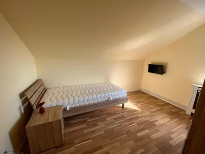 Ein Bett oder Betten in einem Zimmer der Unterkunft Auf dem Berge Hohegeiß