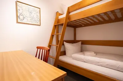 Ein Bett oder Betten in einem Zimmer der Unterkunft Zinnie