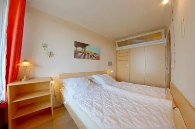Ein Bett oder Betten in einem Zimmer der Unterkunft Apartment Süd-Panorama mit Pool & Sauna