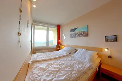 Ein Bett oder Betten in einem Zimmer der Unterkunft Apartment Süd-Panorama mit Pool & Sauna