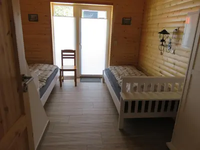 Ein Bett oder Betten in einem Zimmer der Unterkunft Ferienhaus Diana in Thale OT Altenbrak