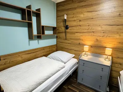 Ein Bett oder Betten in einem Zimmer der Unterkunft FeWo Traumblick im Ferienpark Altenau