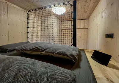 Ein Bett oder Betten in einem Zimmer der Unterkunft Treehouse In The Harz National Park