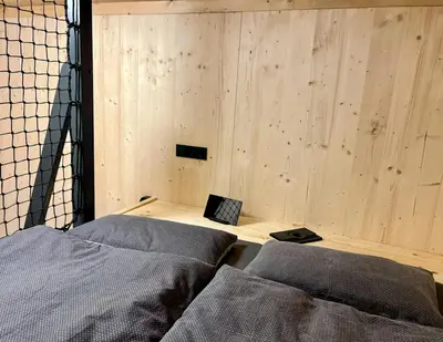 Ein Bett oder Betten in einem Zimmer der Unterkunft Treehouse In The Harz National Park