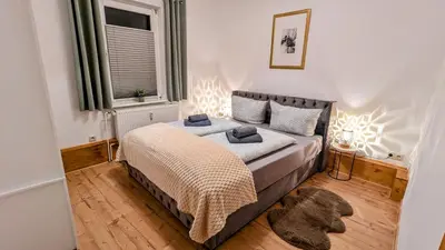 Ein Bett oder Betten in einem Zimmer der Unterkunft ADresseApartments 2 - E-Kamin & Parkplatz