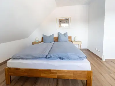 Ein Bett oder Betten in einem Zimmer der Unterkunft Forest Villa with Sauna