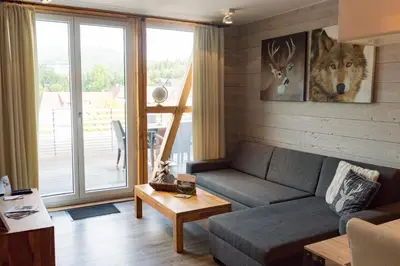 Ein Sitzbereich in der Unterkunft StrandBerg's Stadt Chalet